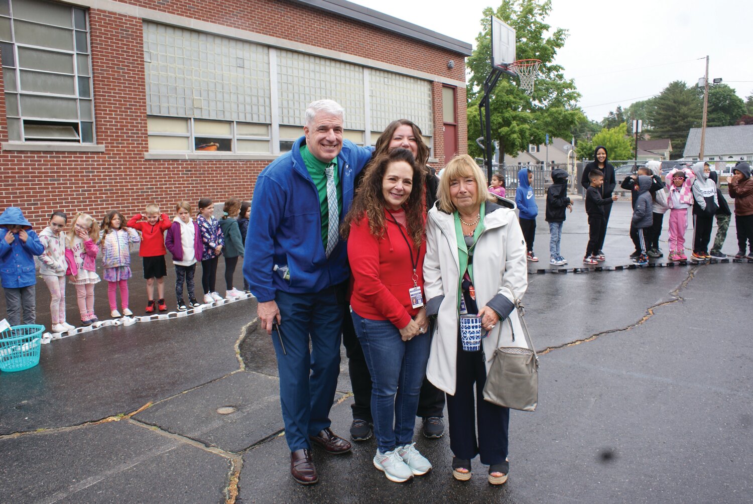 IMPRESSED MAYBE? Principal James Zanfini joins Scappaticca and Vessella along with  Assistant Superintendent Nora Cole (right) who just had to come see this amazing display of kindness come to fruition. (Photo by Steve Popiel)